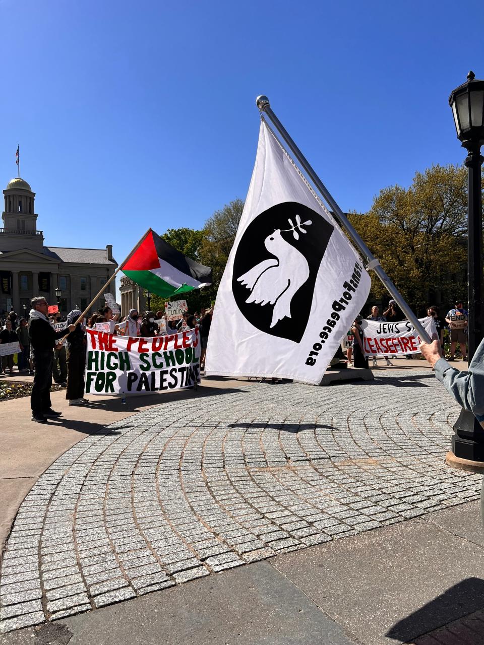 A group of more than 100 residents — including students from Iowa City High and members of an Iowa City Students for Justice in Palestine rally — gathered on the Pentacrest at 3:30 p.m. on Friday to protest the Israel-Hamas War.