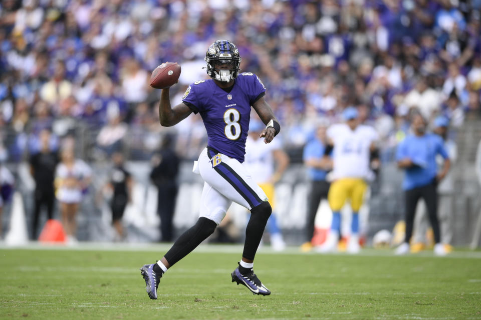 Baltimore Ravens quarterback Lamar Jackson scrambles against the Los Angeles Chargers during the first half of an NFL football game, Sunday, Oct. 17, 2021, in Baltimore. (AP Photo/Nick Wass)