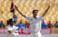 Cricket - India v Australia - Fourth Test cricket match - Himachal Pradesh Cricket Association Stadium, Dharamsala, India - 28/03/17 - Australia's Pat Cummins (R) celebrates after dismissing India's Murali Vijay. REUTERS/Adnan Abidi - RTX32ZM6