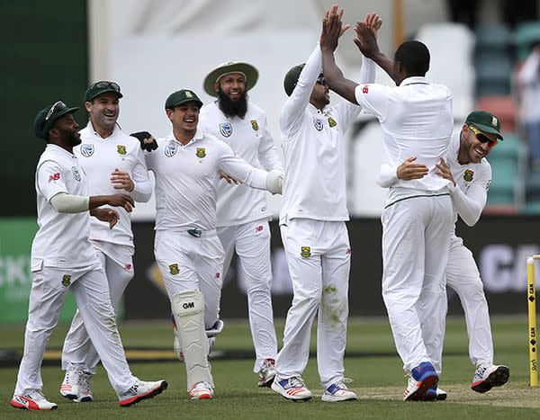 South African teammates celebrate after Kagiso Rabada took the wicket of Australia's Callum Ferguson. Photo: AAP