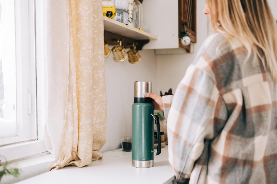 Filling a flask with hot drinks could help keep you warm and save money. (Getty Images)