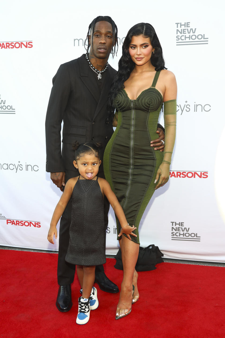 Recording artist Travis Scott (left to right), daughter Stormi Webster, and Kylie Jenner attend The New School's 72nd Annual Parsons Benefit at the rooftop of Pier 17 in New York City, Tuesday, June 15, 2021. increase.  (Photo credit: Andy Kropa/Invision/AP)