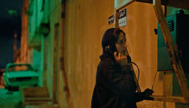 An Iranian female journalist (Zar Amir Ebrahimi) makes a desperate phone call in 