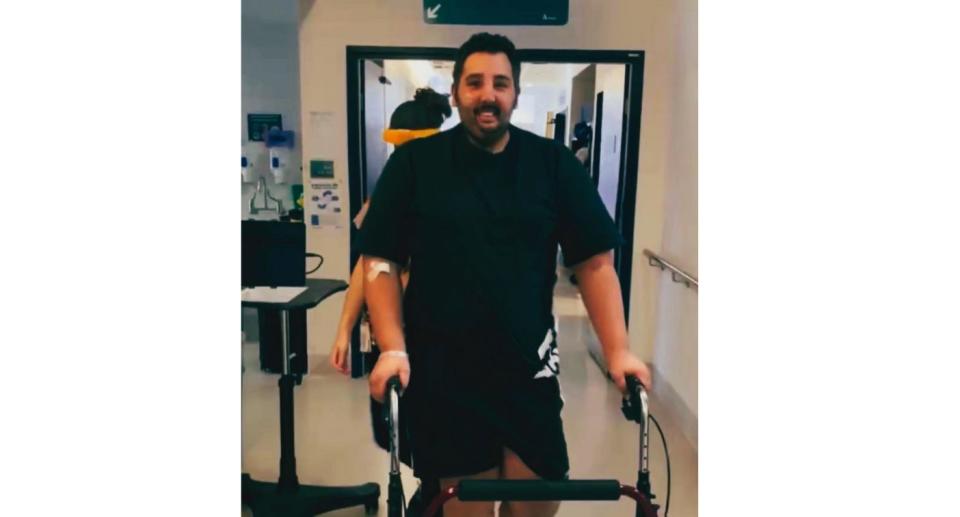 Theo Ikosidekas on crutches in hospital