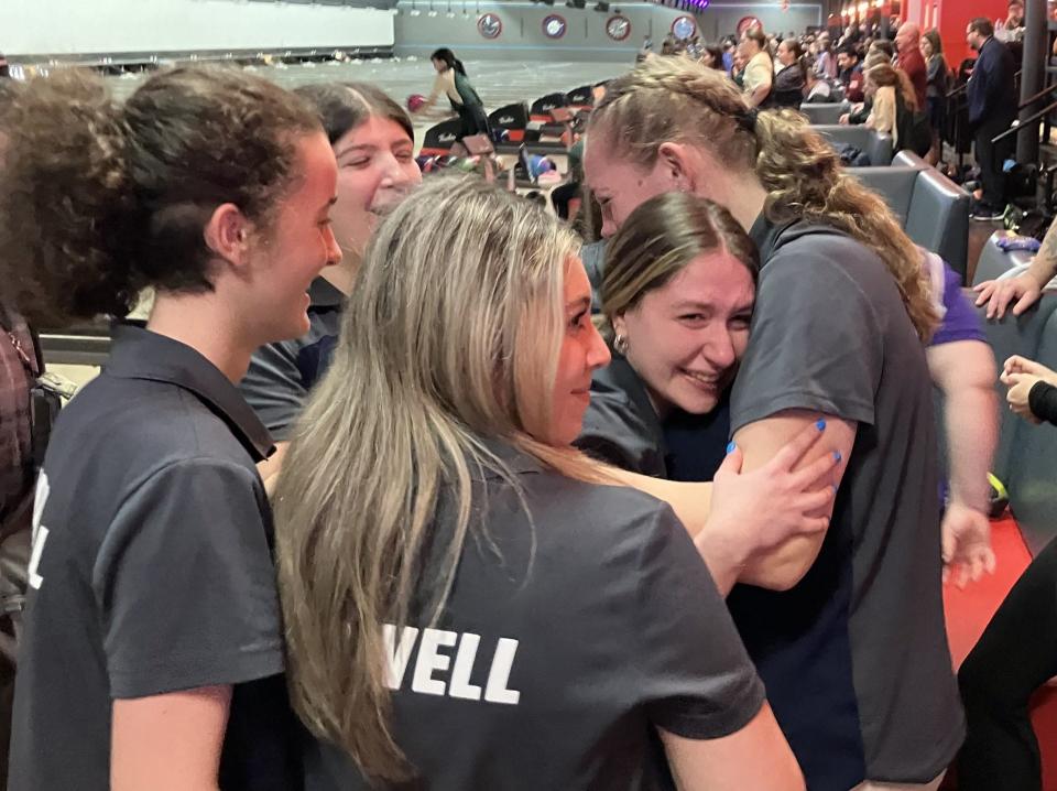 NJSIAA team bowling finals at Bowlero North Brunswick on Tuesday, Feb. 27, 2024. Howell senior Alyssa Riccio (facing) gets a hug from teammate Kayleigh Germadnig after throwing the final ball. The Rebels repeated as Group 4 girls champion.