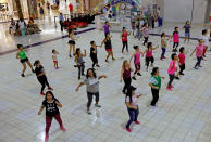 <p>Residents do their daily routine Zumba class inside a mall on the island of Guam, a U.S. Pacific Territory August 10, 2017. (Erik De Castro/Reuters) </p>