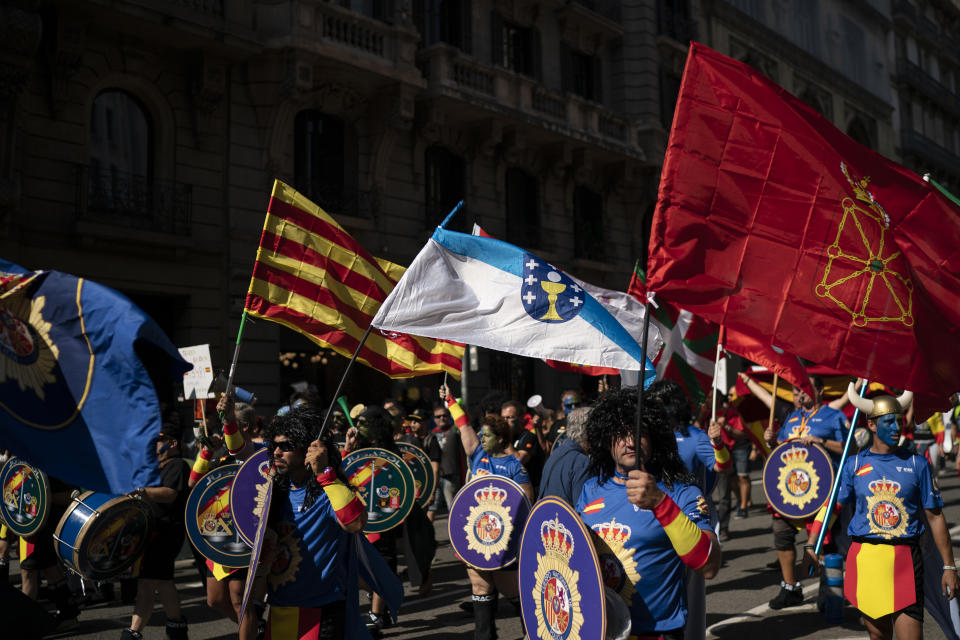 Members and supporters of National Police and Guardia Civil march during a protest demanding better pay in Barcelona, Spain, Saturday, Sept. 29, 2018. (AP Photo/Felipe Dana)