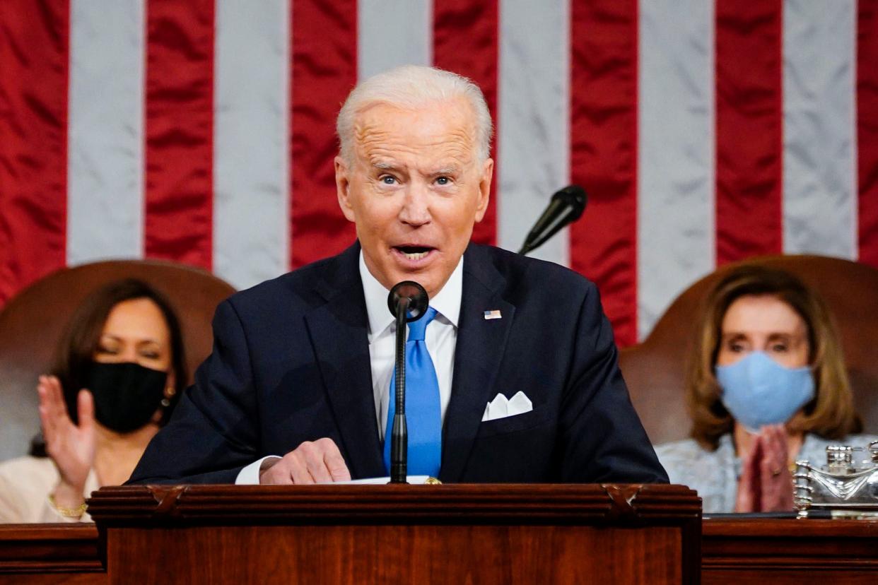 <p>President Joe Biden addresses the joint session of Congress on 28 April</p> (AP)