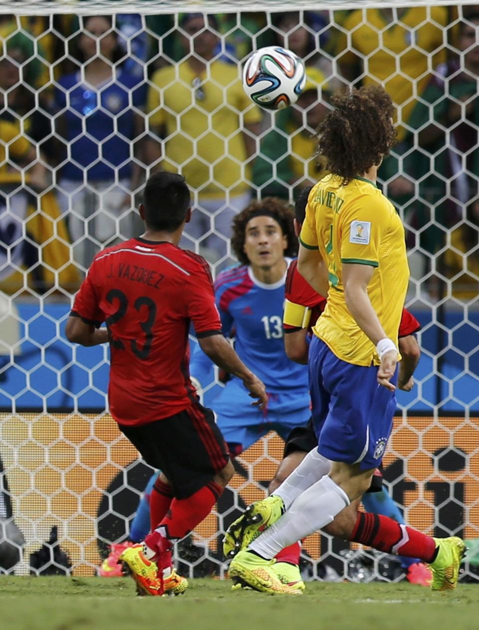 Mexico's goalkeeper Guillermo Ochoa prepares to make a save during the 2014 World Cup Group A soccer match between Brazil and Mexico at the Castelao arena in Fortaleza June 17, 2014. (Sergio Moraes/Reuters)