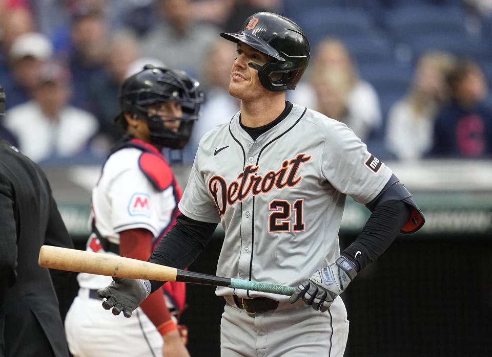 Detroit Tigers' Mark Canha (21) walks back to the dugout after striking out in the fifth inning of a baseball game against the Cleveland Guardians, Monday, May 6, 2024, in Cleveland. Guardians' catcher Bo Naylor, left, looks on. (AP Photo/Sue Ogrocki)