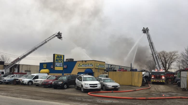 Auto shop owner could only watch as business burned