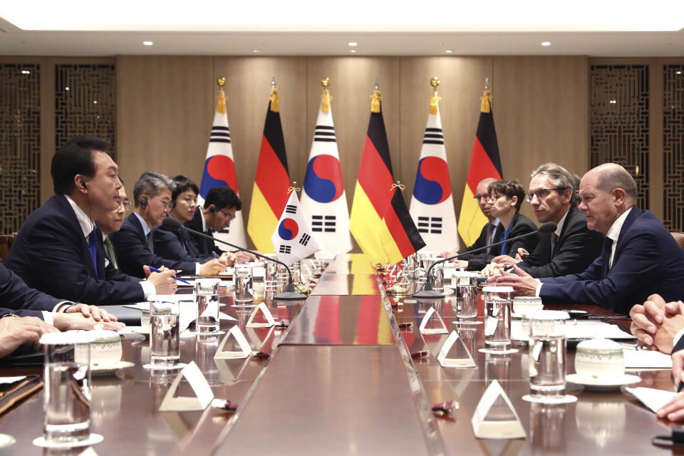 German Chancellor Olaf Scholz, right, and South Korea's President Yoon Suk Yeol, left, talk during their meeting at the Presidential Office in Seoul, South Korea Sunday, May 21, 2023. Scholz arrived in Seoul on Sunday for the summit with Yoon after attending the G7 summit in Hiroshima, Japan. (Chung Sung-Jun/Pool Photo via AP)