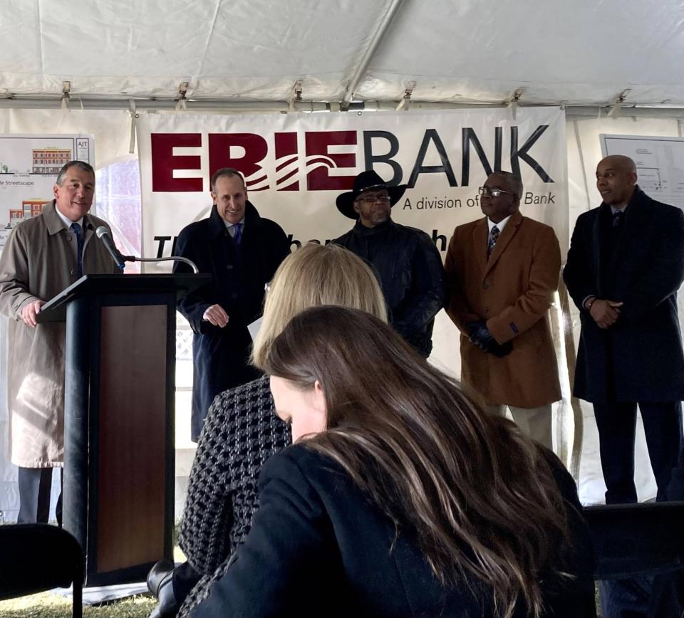 Tim NeCastro, CEO of Erie Insurance, left, welcomed news of ErieBank's plans to open a new branch at East 10th and Parade streets as part of the East Side Renaissance. Next to him from left, are ErieBank President Dave Zimmer and the founders of the East Side Renaissance, Bishop Dwane Brock, Marcus Atkinson and Matt Harris.