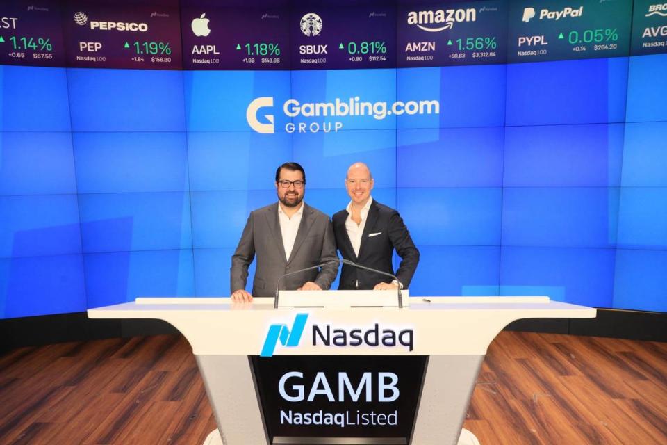 Kevin McCrystle and Charles Gillespie, co-founders of Gambling.com Group, pose for a picture after their business became a publicly traded company in 2021. The Charlotte natives are looking forward to expanding their headquarters in Charlotte.