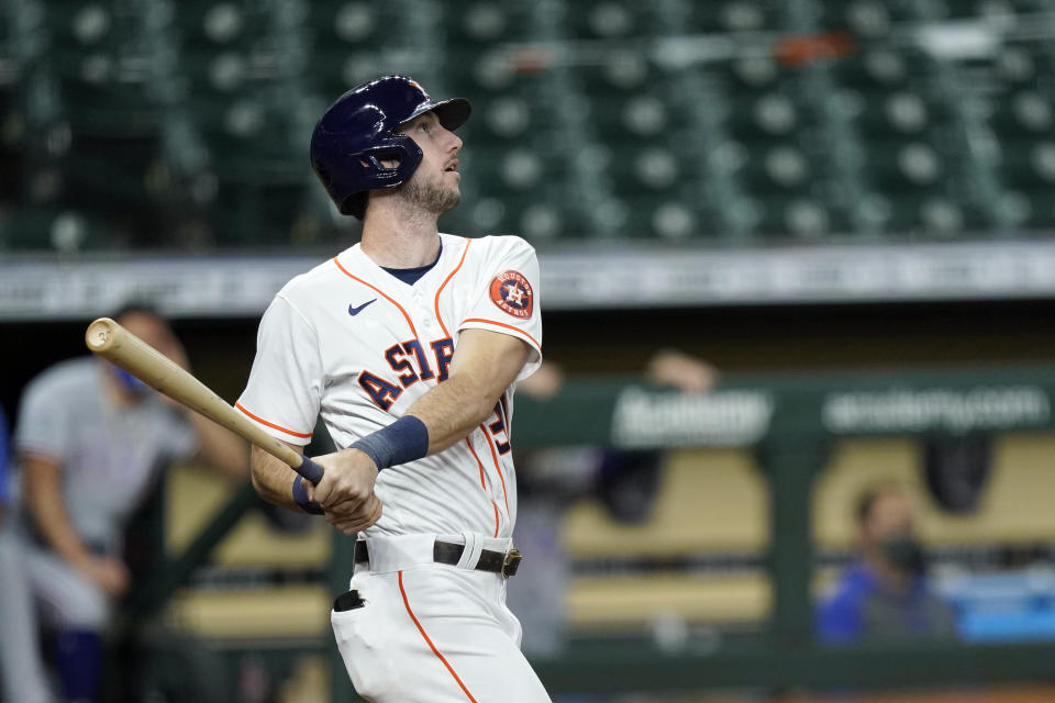 Houston Astros' Kyle Tucker watches his two-run home run against the Texas Rangers during the second inning of a baseball game Thursday, Sept. 17, 2020, in Houston. (AP Photo/David J. Phillip)