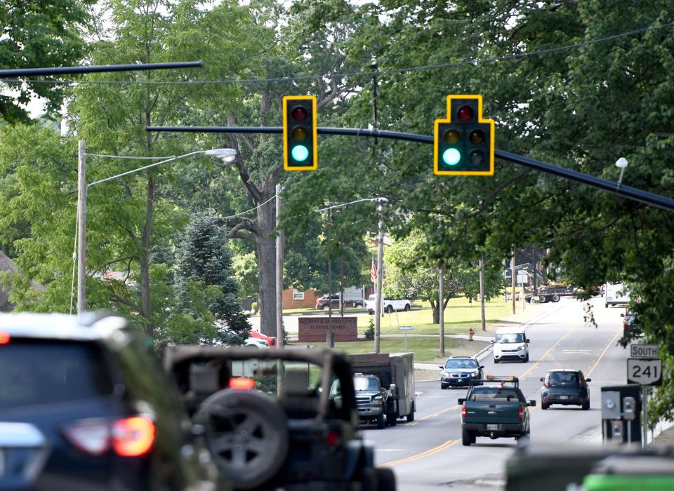 Motorists travel north and southbound Thursday on a newly resurfaced and widened Wales Road NE in Massillon. The project to redo a 1.4-mile stretch of the road started in early 2021.