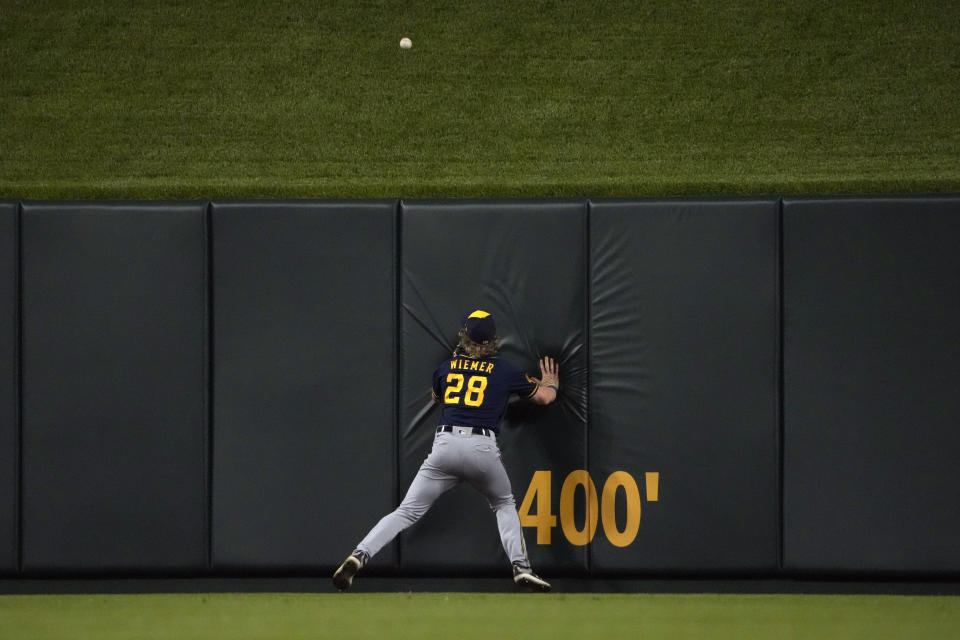 Milwaukee Brewers center fielder Joey Wiemer watches a solo home run by St. Louis Cardinals' Paul DeJong during the sixth inning of a baseball game Wednesday, May 17, 2023, in St. Louis. (AP Photo/Jeff Roberson)