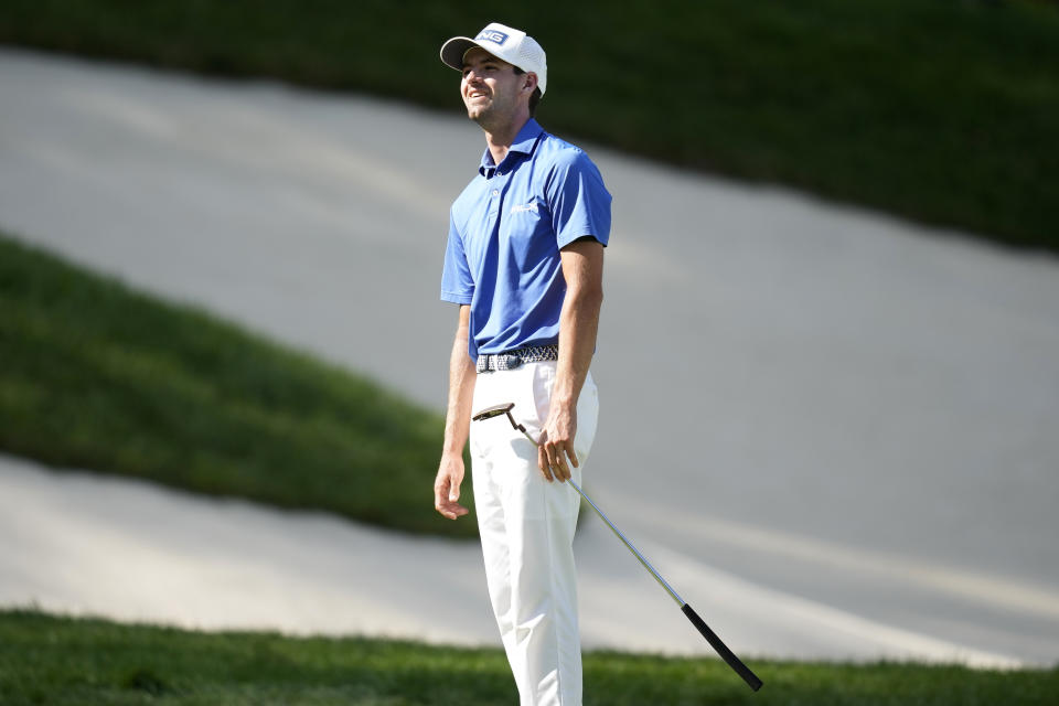 Alex Smalley reacts after missing a putt on the 18th green during the final round of the John Deere Classic golf tournament, Sunday, July 9, 2023, at TPC Deere Run in Silvis, Ill. (AP Photo/Charlie Neibergall)