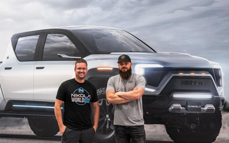 Trevor Milton, left, in front of his company's Badger pick-up truck - Nikola