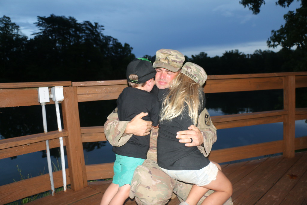 Stephen Boissey reuniting with his children at Camp Hanes. (Photo credit YMCA Camp Hanes)