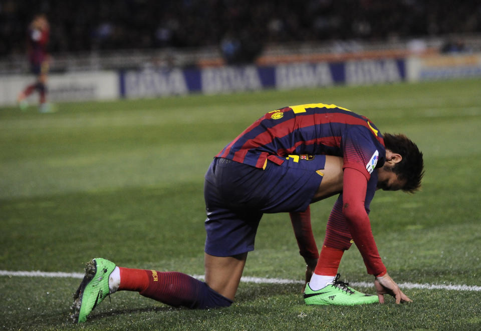 FC Barcelona's Neymar da Silva of Brazil, kneels on the pitch at the end of the match against Real Sociedad, during their Spanish League soccer match, at Anoeta stadium in San Sebastian, Spain, Saturday, Feb. 22, 2014. FC Barcelona lost the match 3-1. (AP Photo/Alvaro Barrientos)