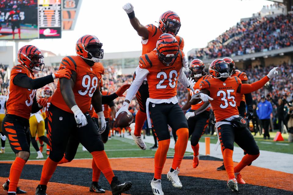 Cincinnati Bengals cornerback Eli Apple (20) celebrates a deep interception return in the first quarter of the NFL Week 12 game between the Cincinnati Bengals and the Pittsburgh Steelers at Paul Brown Stadium in downtown Cincinnati on Sunday, Nov. 28, 2021.