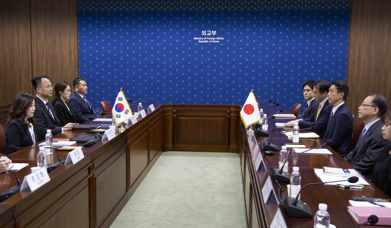 Japanese Funakoshi Takehiro, right, director-general for Foreign Ministry's Asian and Oceanian Affairs Bureau and Japanese Ando Atsushi, second right, deputy director-general of Defense Ministry's Defense Policy Bureau attend a meeting with South Korean Seo Min-jeong, left, director-general of the Asian and Pacific Affairs Bureau and Woo Kyoung-suk, second left, deputy director-general of the International Policy Bureau, at the Foreign Ministry in Seoul Monday, April 17, 2023. (Jeon Heon-Kyun/Pool Photo via AP)