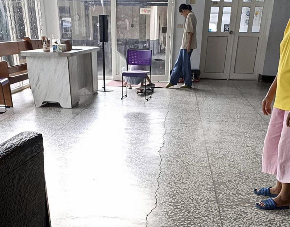 This photo provided by the Mount Carmel Presbyterian Church shows a crack on the floor at the church following an earthquake, in Yuli township in Hualian, eastern Taiwan, Sunday, Sept. 18, 2022. (The Mount Carmel Presbyterian Church via AP)