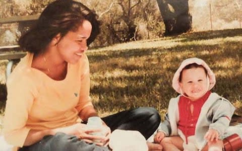 : Suits actress Meghan Markle, who is dating Prince Harry, pictured in Rwanda, pictured as a child with her mother Doria. - Credit: TIM STEWART NEWS LIMITED