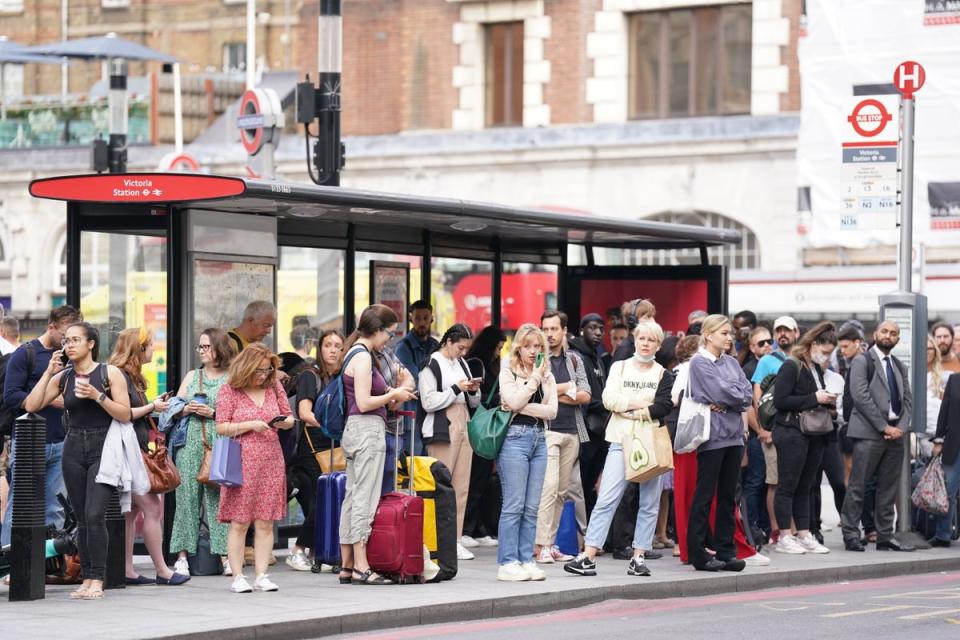 People waiting for buses outside Victoria Station, central London, amid the Tube strike (Kirsty O’Connor/PA) (PA Wire)