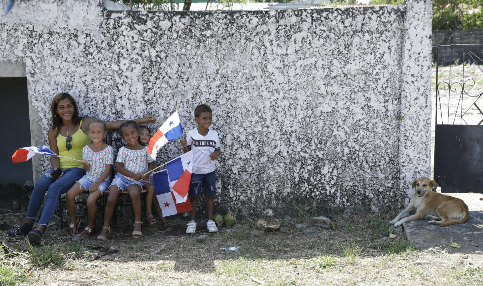 Children wait for the arrival of Pope Francis outside the Casa Hogar del Buen Samaritano in Panama City, Sunday, Jan. 27, 2019. Francis wraps up his trip to the Central American country on Sunday with a final World Youth Day Mass and a visit to a church-run home for people living with AIDS. (AP Photo/Alessandra Tarantino)