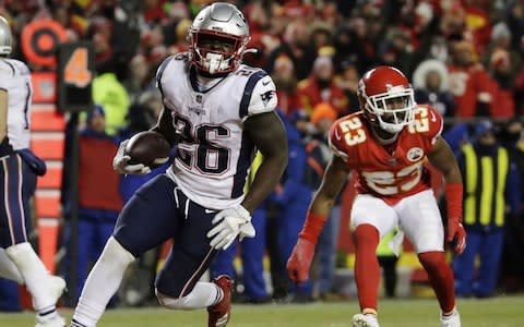 New England Patriots running back Sony Michel (26) runs to the end zone for a touchdown during the second half of the AFC Championship NFL football game against the Kansas City Chiefs, Sunday, Jan. 20, 2019, in Kansas City - Credit: AP