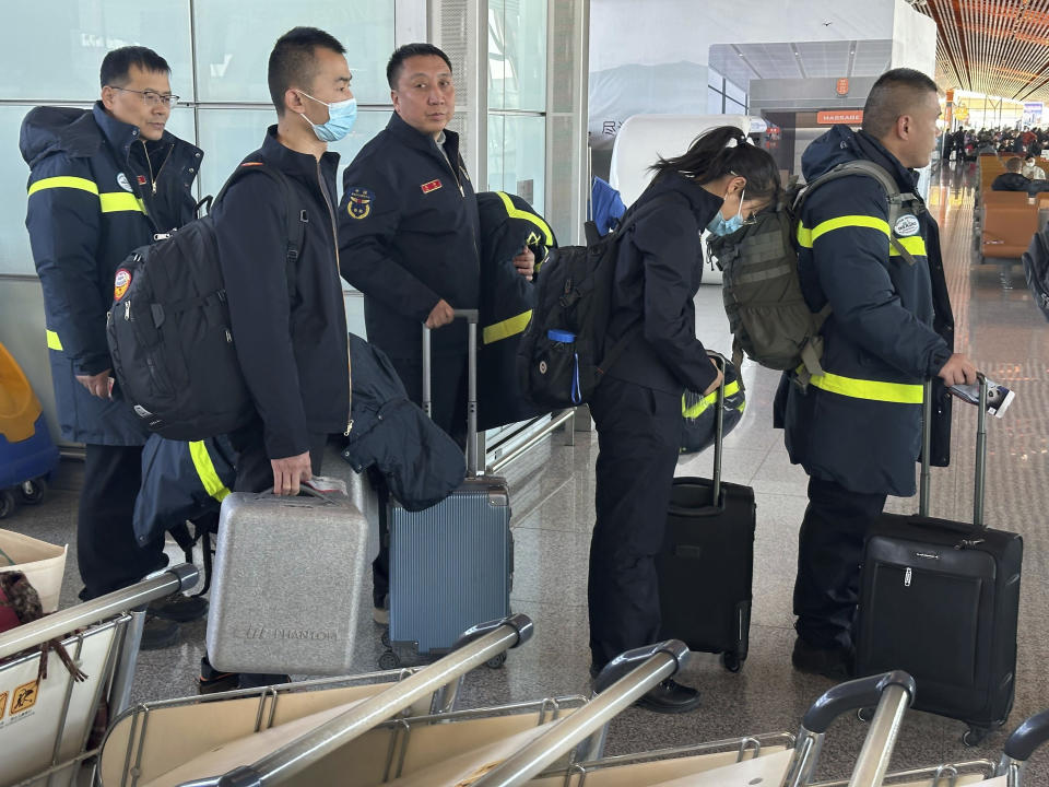 Rescue workers prepare to board a flight to Aksu, Xinjiang from Beijing Capital International Airport in Beijing on Tuesday, Jan. 23, 2024. An earthquake struck a sparsely populated part of China’s western Xinjiang region early Tuesday, injuring people and damaging or collapsing scores of homes in freezing cold weather, authorities said. (AP Photo/Ng Han Guan)