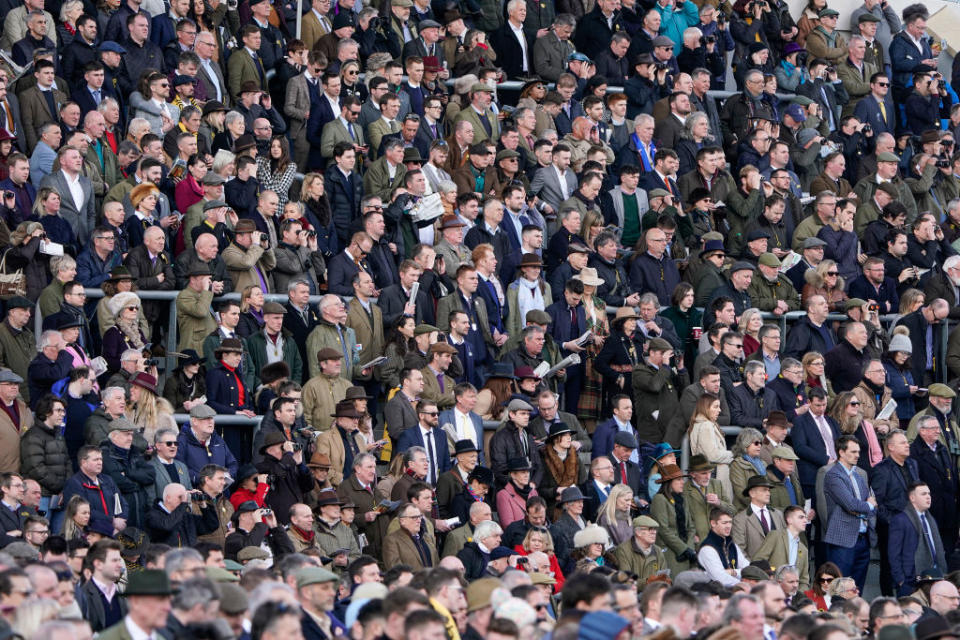 A general view as racegoers watch the action on Gold Cup day at Cheltenham Racecourse on March 13, 2020 in Cheltenham, England.