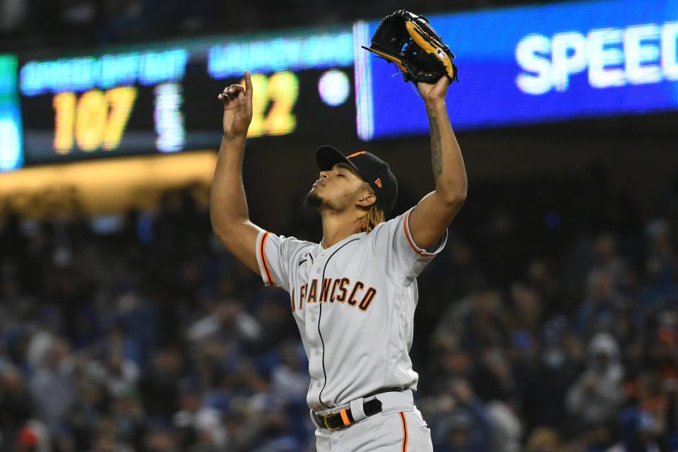 San Francisco Giants relief pitcher Camilo Doval (75) celebrates after defeating the Los Angeles Dodgers in Game 3 of the NLDS.