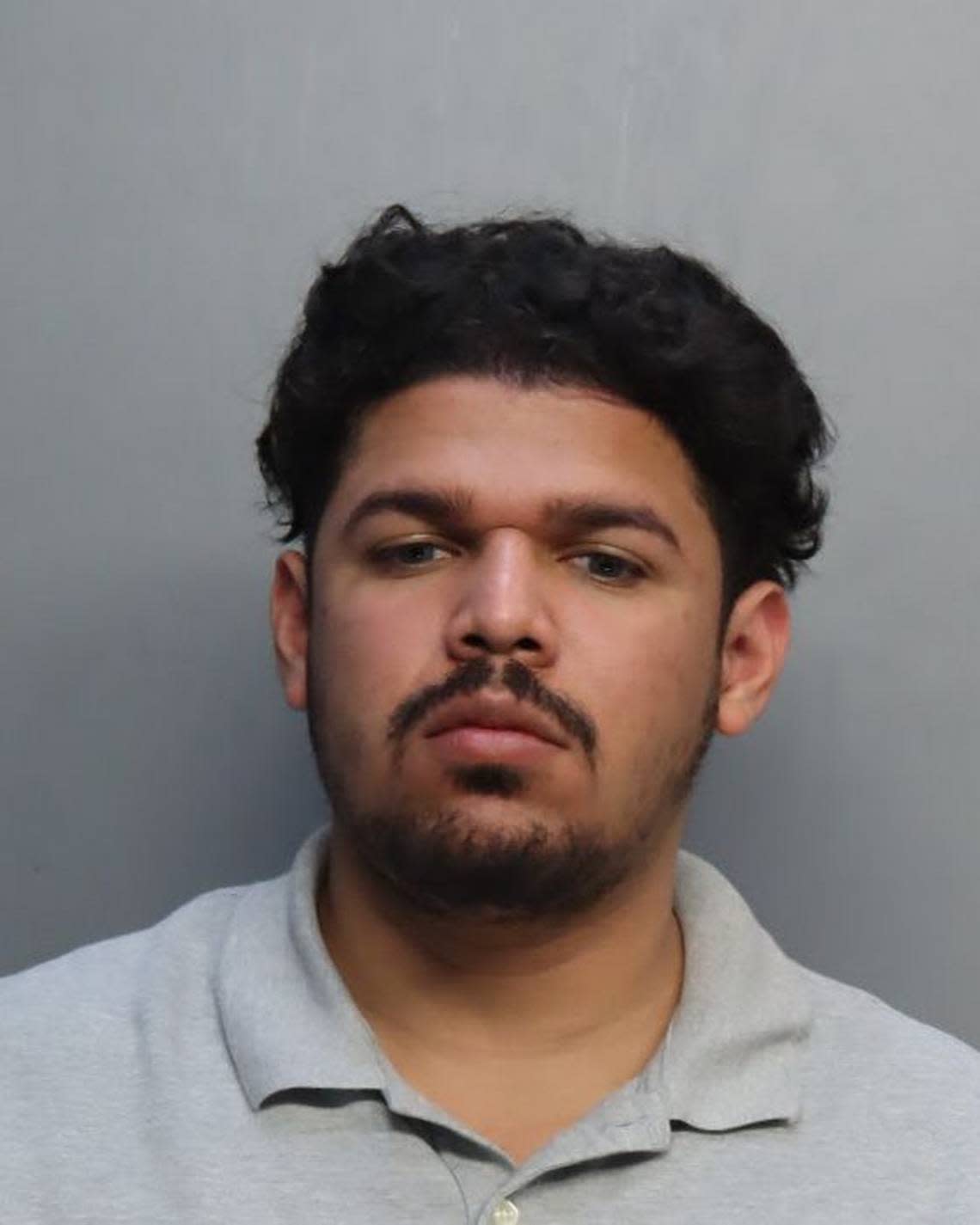 Roger Alaniz, a Miami Senior High School teacher, was charged with inappropriately messaging two of his students, threatening one of them, police said. 