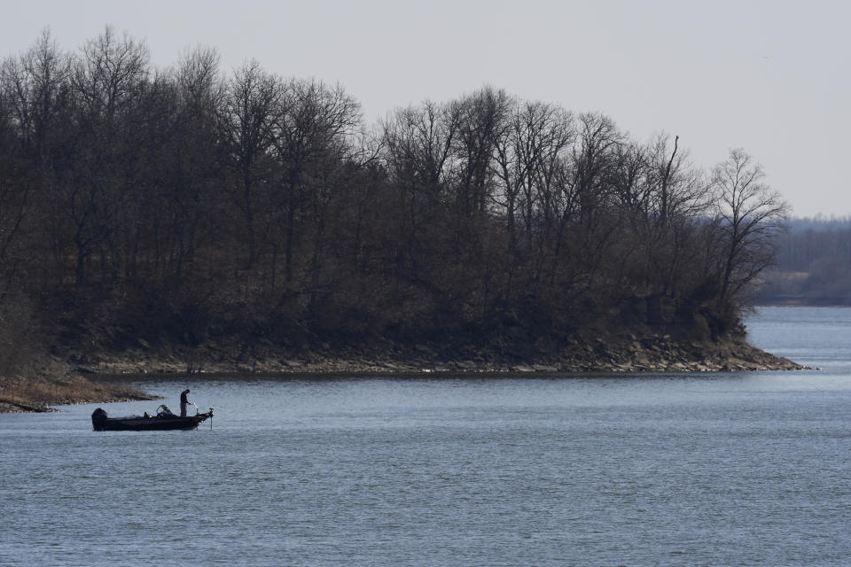 A fisherman takes advantage of unseasonably warm weather Sunday, Feb. 25, 2024, at Smithville Lake near Paradise, Mo. With highs in the mid 70s, parts of the midwest are experiencing temperatures nearly 30 degrees hotter than average. (AP Photo/Charlie Riedel)