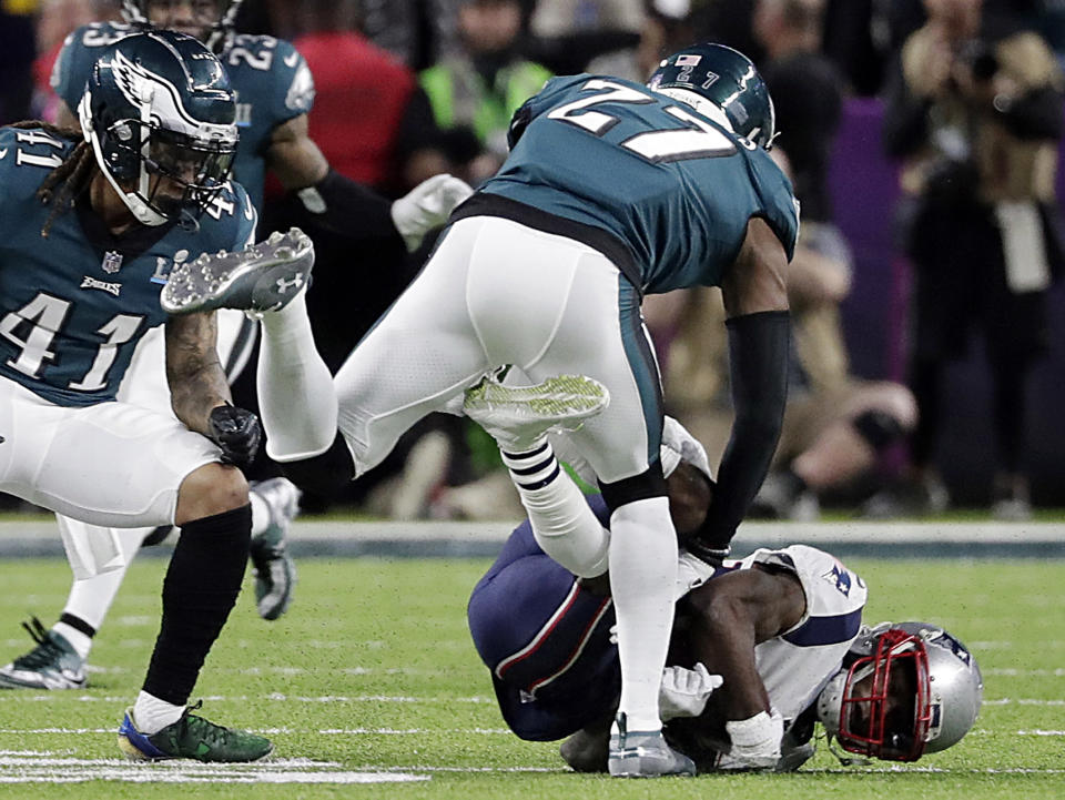 Philadelphia's Malcolm Jenkins delivers a hit to New England wide receiver Brandin Cooks in February's Super Bowl. (AP) 