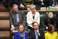 Britain's Conservative MP and former prime minister Theresa May listens during a debate on Brexit in London