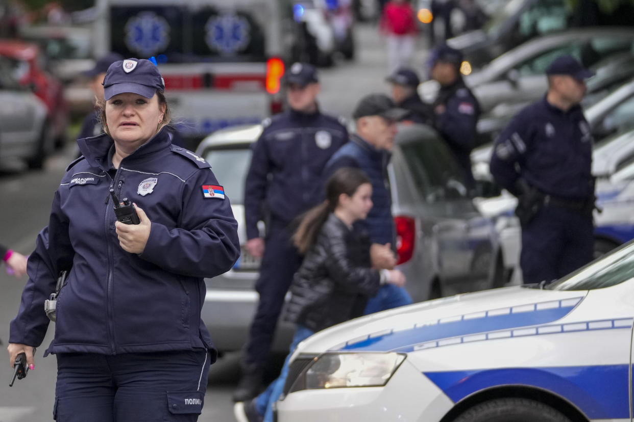 Police blocks street around the Vladislav Ribnikar school in Belgrade, Serbia, Wednesday, May 3, 2023. A teenage boy opened fire early Wednesday in a school in central Belgrade, causing injuries. (AP Photo/Darko Vojinovic)