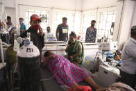 Patients use oxygen cylinders in hospital after a leakage in the oxygen plant in Nashik, in the Indian state of Maharashtra, Wednesday, April 21, 2021. A local administrator in western India says 22 patients have died in a hospital when their oxygen supply was interrupted by a leakage in a supply tank. The official says the oxygen supply has since been resumed to other patients. (AP Photo)