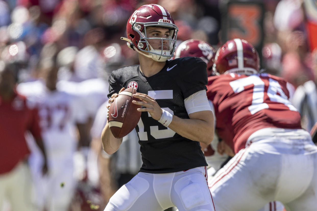 Alabama quarterback Ty Simpson (15) is one of the frontrunners competing for this year's starting job, but he has big shoes to fill. (AP Photo/Vasha Hunt)
