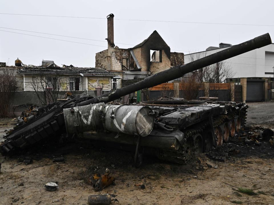 This photograph taken on April 2, 2022 shows a destroyed Russian tank in Dmytrivka village