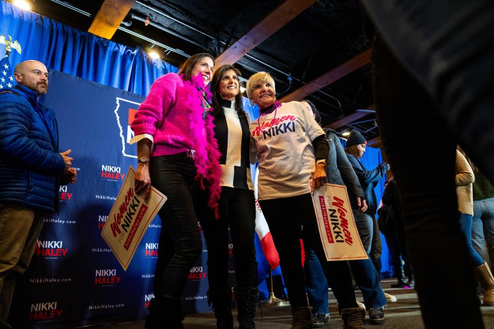 Former U.N. Ambassador Nikki Haley takes photos with supporters after a campaign stop Sunday, Jan. 14, 2024, at Jethro's BBQ in Ames, IA.