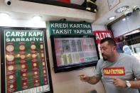 Gold dealer Gunay Gunes talks to Reuters during an interview in Istanbul