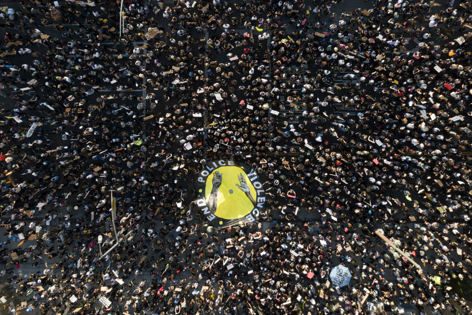 Large protest in Los Angeles, seen from above.