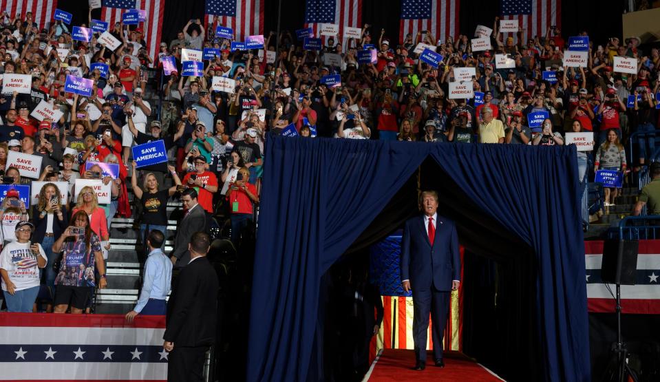 Former President Donald Trump enters the stage at a rally in Youngstown, Ohio, on Sept. 17.