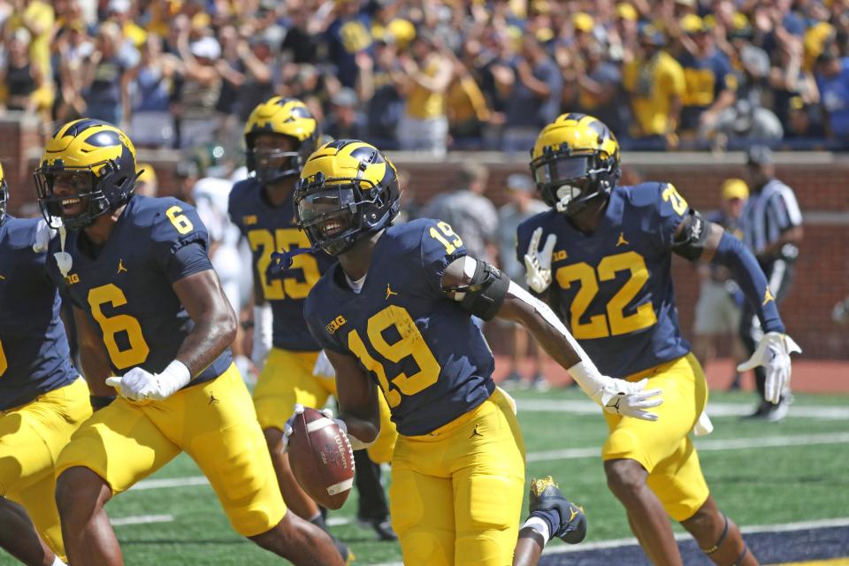 Michigan defensive back Rod Moore celebrates his interception against Colorado State quarterback Clay Millen during the first half on Saturday, Sept. 3 , 2022, in Ann Arbor.