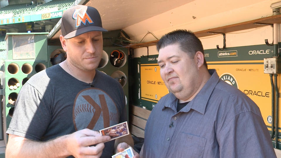 Marlins catcher A.J. Ellis checking out some 1992 Topps. (Yahoo Sports)