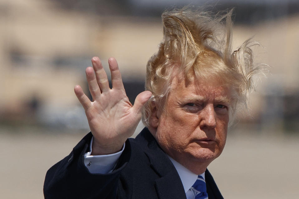 President Donald Trump boards Air Force One for a trip to White Sulphur Springs, W.Va., April 5, 2018. (AP Photo/Evan Vucci)   